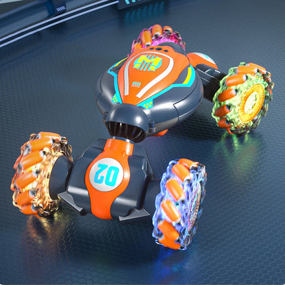 Gesture Sensing RC 4WD Twist Stunt Car Toy 2.4G Remote Control Rotating Car Toy with Lights Music Orange